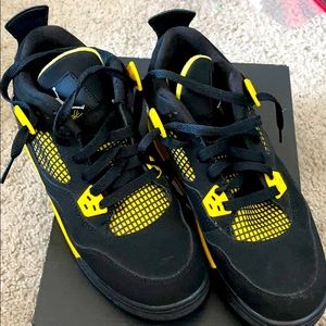Jordan 4 Black and Yellow Youth sneakers